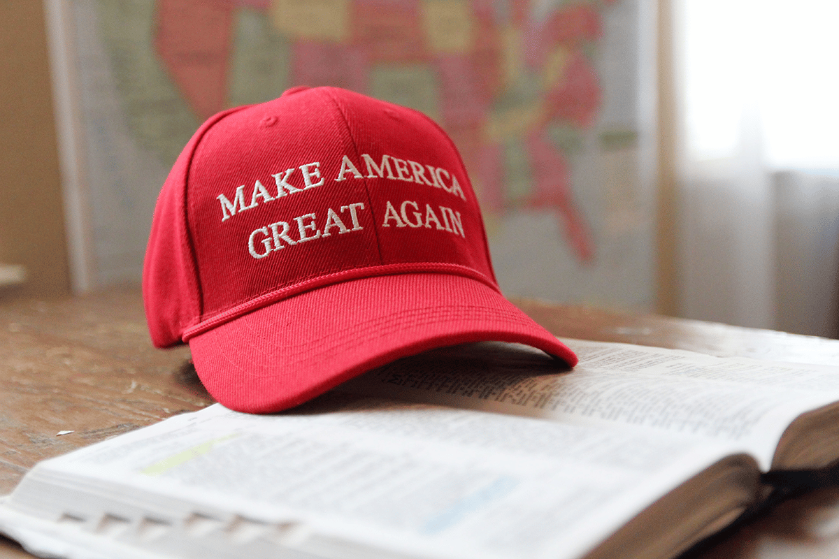 make america great again hat sitting on a book