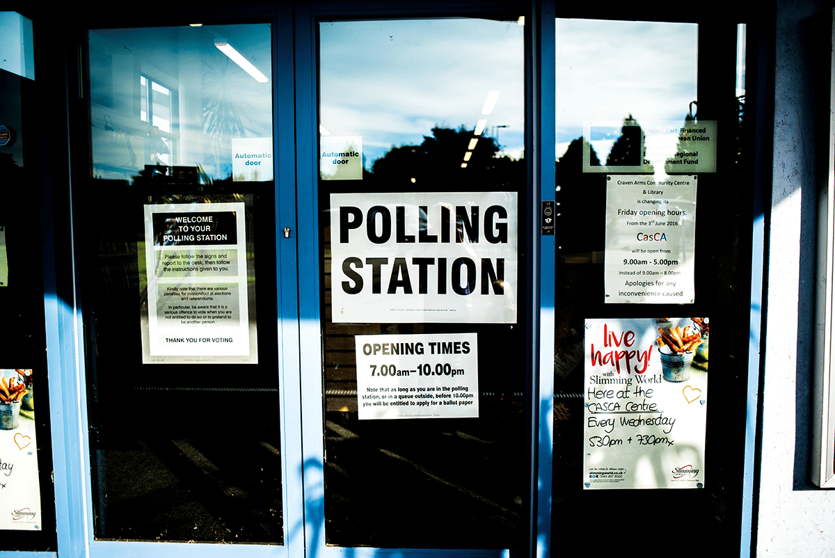 polling station door with signs