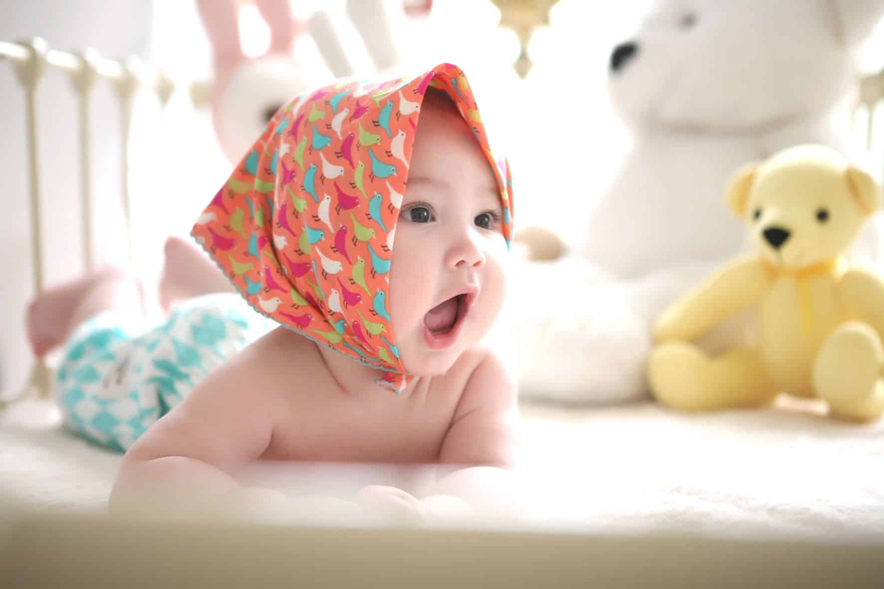 baby with handkerchief on head