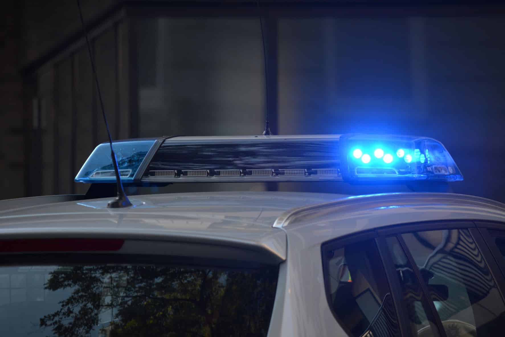 blue lights on top of a police car