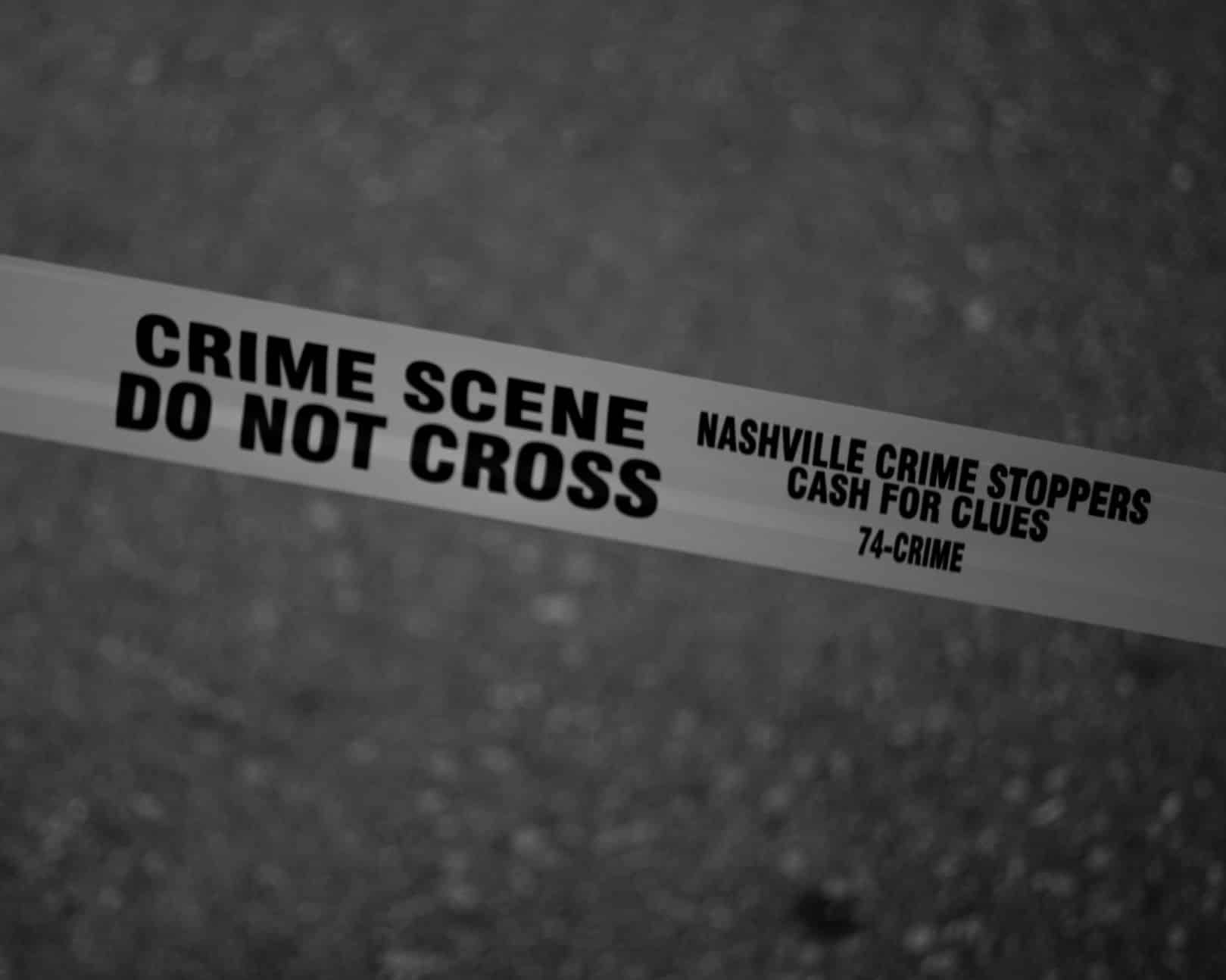 crime scene tape over road